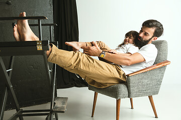 Image showing Father playing with young son in their sitting room