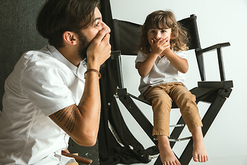 Image showing Father playing with young son in their sitting room