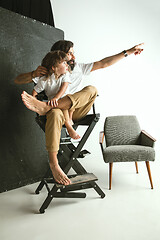 Image showing Father playing with young son in their sitting room