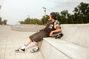 Image showing Skateboarder at the city\'s street in cloudly day