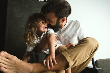 Image showing Father playing with young son in their sitting room