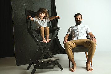 Image showing Father playing with young son in their sitting room