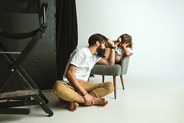 Image showing Father playing with young son in their sitting room