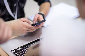 Image showing business people hands using smart phone