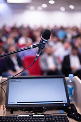 Image showing laptop computer and microphone at podium