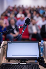 Image showing laptop computer and microphone at podium