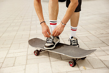 Image showing Skateboarder at the city\'s street in cloudly day