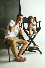 Image showing Father playing with young son in their sitting room