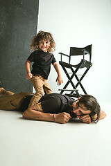 Image showing Father playing with young son in their sitting room