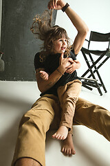 Image showing Father playing with young son in their sitting room