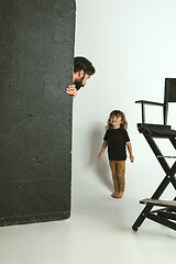 Image showing Father playing with young son in their sitting room