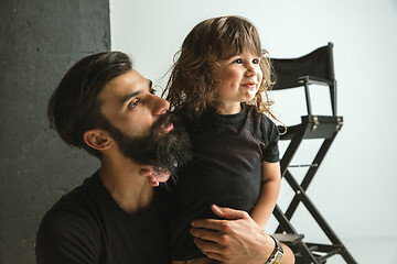 Image showing Father playing with young son in their sitting room