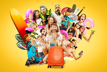 Image showing Young people isolated on yellow studio background