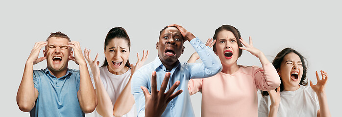 Image showing Young people in stress isolated on white studio background