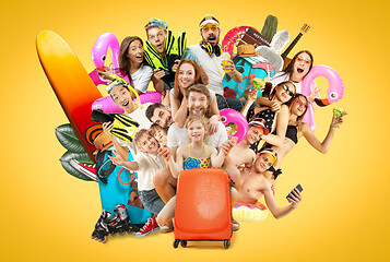 Image showing Young people isolated on yellow studio background