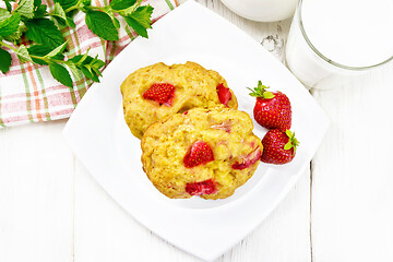 Image showing Scones with strawberry in plate on board top