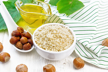 Image showing Flour hazelnut in bowl on white board