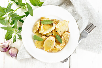 Image showing Parsnips baked in plate on board top