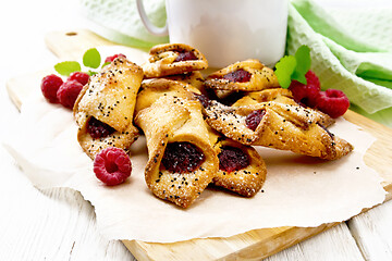 Image showing Cookies with raspberries on white board