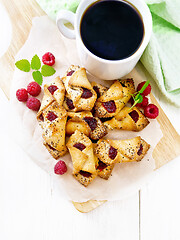 Image showing Cookies with raspberries on board top