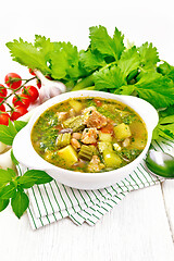 Image showing Soup with pisto sauce in bowl on wooden board