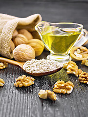 Image showing Flour walnut in spoon on wooden board