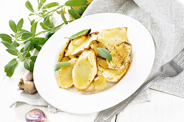 Image showing Parsnips baked in plate on light wooden board