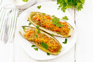 Image showing Cucumber stuffed with meat and vegetables on light board top