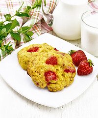 Image showing Scones with strawberry in plate on board