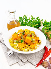 Image showing Porridge millet with spicy pumpkin in plate on napkin