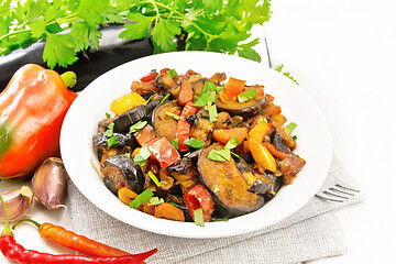 Image showing Ragout with eggplant and pepper on wooden board