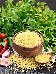 Image showing Bulgur in bowl with vegetables on wooden board