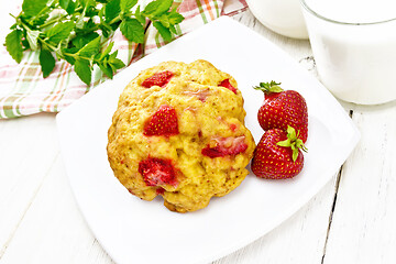 Image showing Scones with strawberry in plate on light wooden board