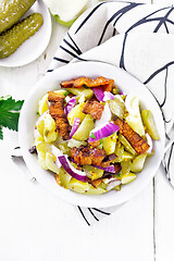 Image showing Salad potato with bacon and cucumber in plate on light board top