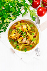 Image showing Soup with mung and noodles in bowl on board top