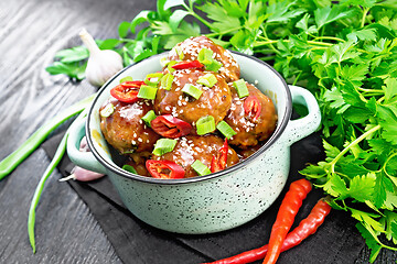 Image showing Meatballs in sweet and sour sauce on board