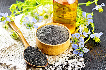 Image showing Flour kalingi in bowl with seeds on dark wooden board