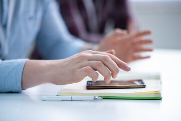 Image showing Young casual businessman using smartphone