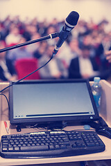 Image showing laptop computer and microphone at podium
