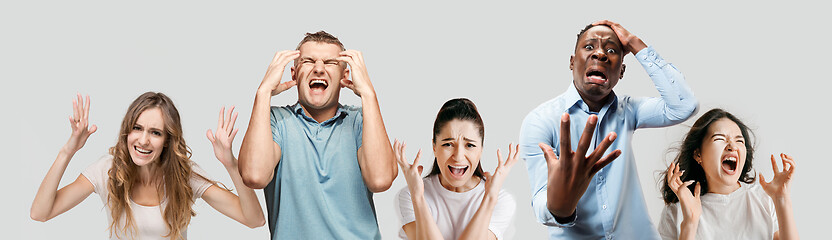 Image showing Young people in stress isolated on white studio background