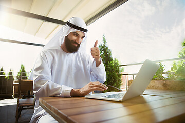 Image showing Arabian saudi businessman working outdoors