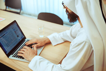 Image showing Arabian saudi businessman working in office