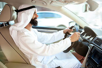 Image showing Arabian saudi businessman driving hir car