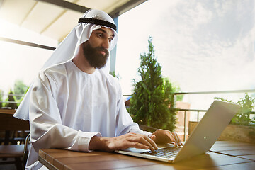 Image showing Arabian saudi businessman working outdoors