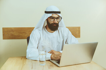 Image showing Arabian saudi businessman working in office