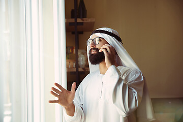 Image showing Arabian saudi businessman working in office