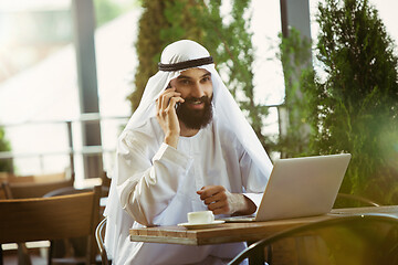 Image showing Arabian saudi businessman working outdoors