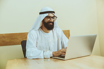 Image showing Arabian saudi businessman working in office