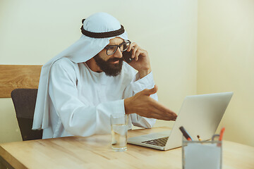 Image showing Arabian saudi businessman working in office