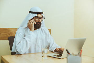 Image showing Arabian saudi businessman working in office